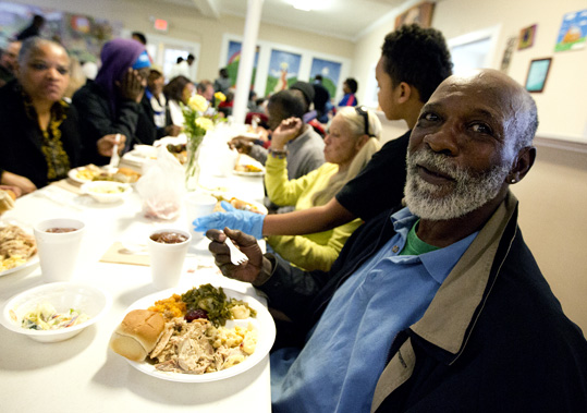 Man enjoys lunch at the Triune Mercy Center