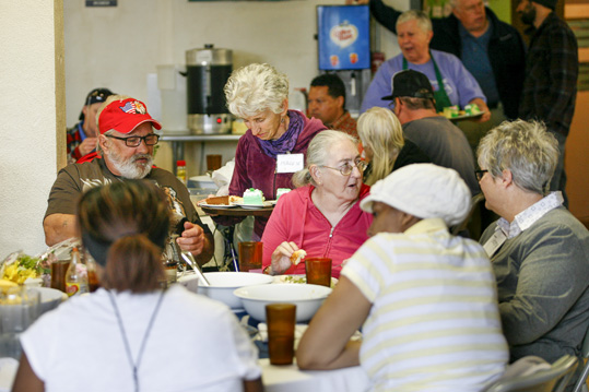 Haywood Street Congregation members are served lunch.